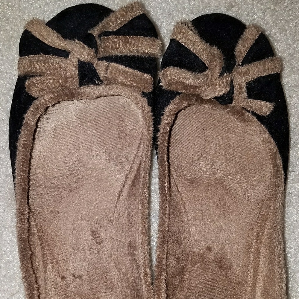 Black faux suede ballet flats with bows